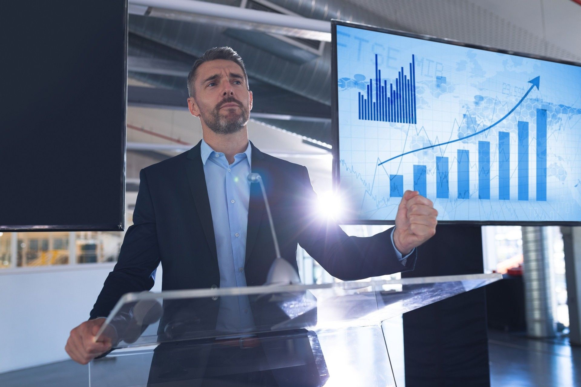 A man effectively communicating and influencing during a business and sales presentation